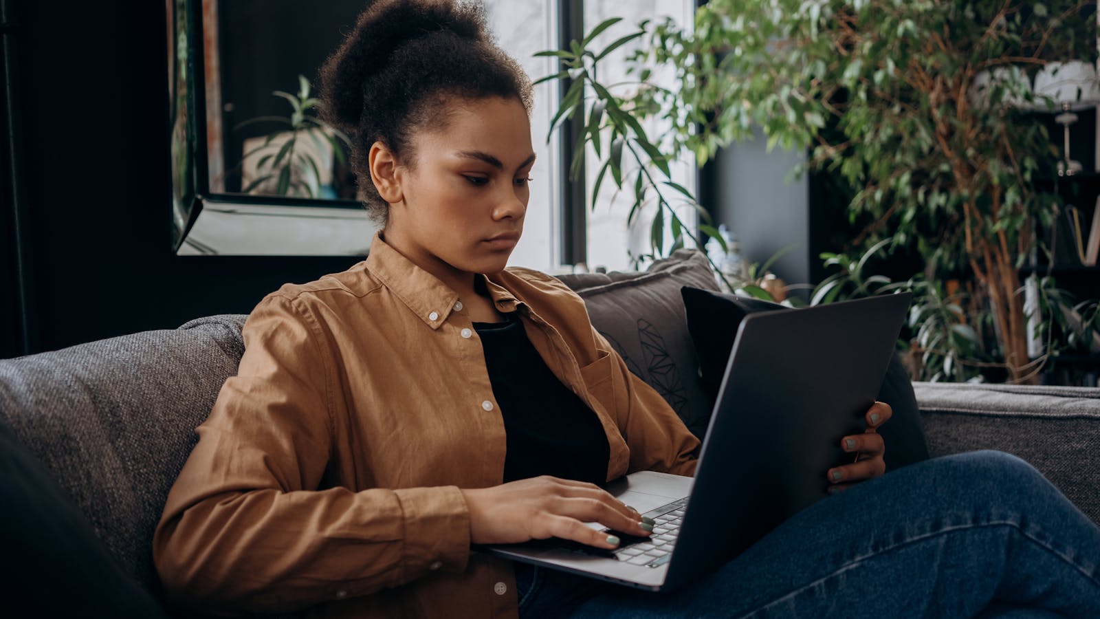 A person managing their accounts on a laptop at home